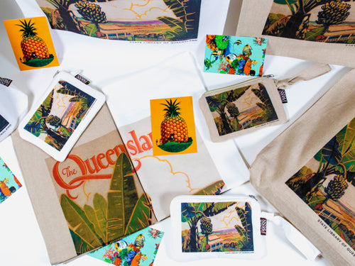 Tea towels and pencil cases with a banana tree printed on them.